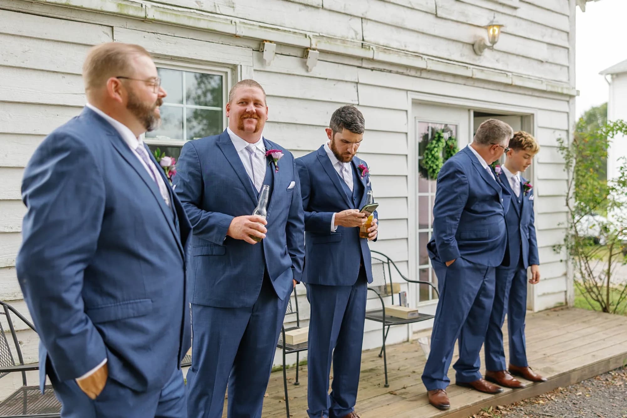 Groomsmen relaxing in the Blacksmith Cottage at Rixey Manor before the ceremony