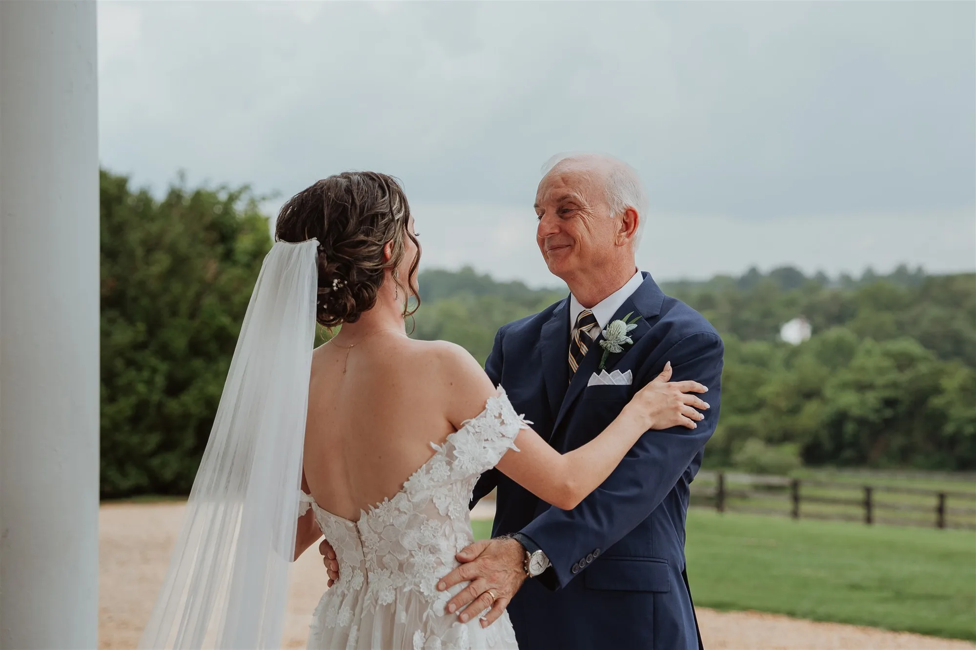 Bride and father share a tender first look moment on the Rixey Manor terrace overlooking Virginia countryside