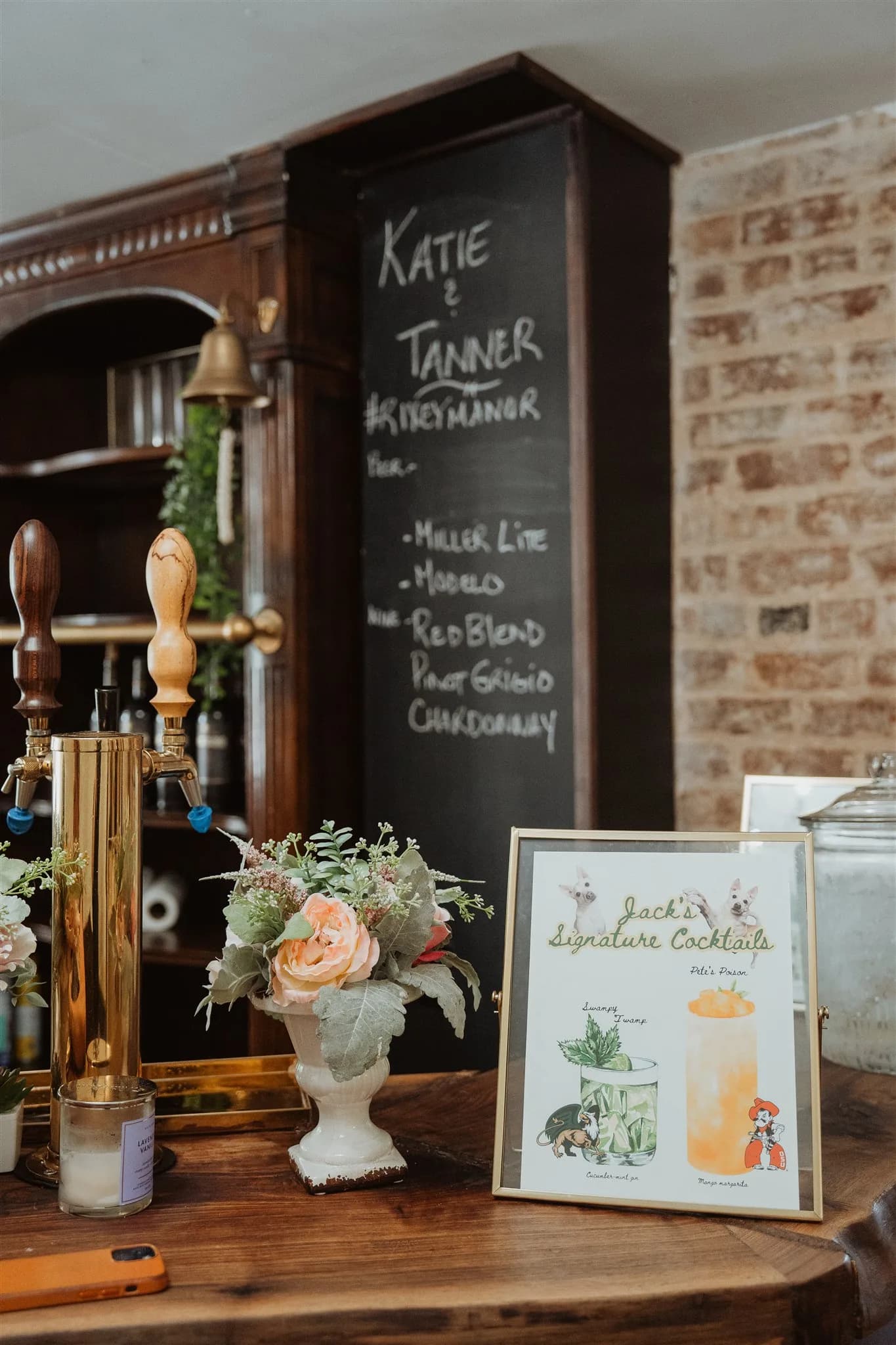 Rixey Manor bar setup with chalkboard menu for Katie & Tanner, gold tap, floral arrangement, and signature cocktail menu
